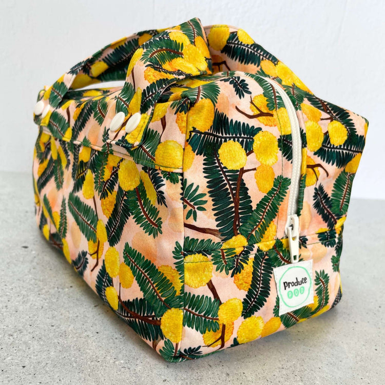 Detailed close up view of the durable woven bag securely zipped on a kitchen benchtop in wattle.