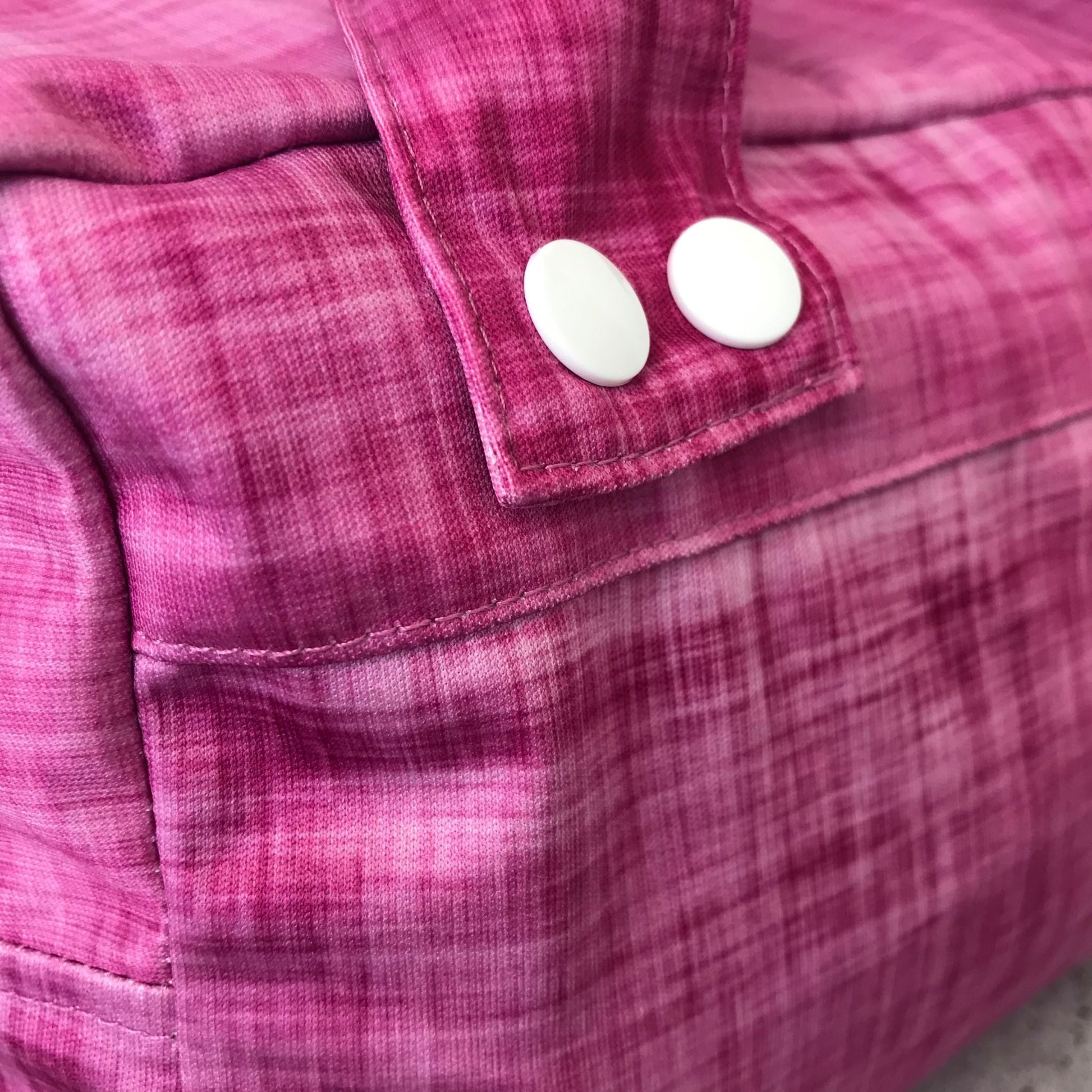Micro view of the lightweight, highly breathable fabric weave engineered to regulate humidity and prevent mould in a refrigerator. Shown in rhubarb.