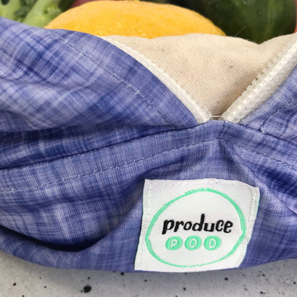 Macro view of the lightweight, highly breathable fabric weave engineered to regulate humidity and prevent mould in a refrigerator. Plum variant.