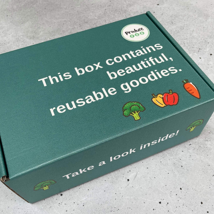 The box that the produce pod gift set containing pods in ocean and gum blossom and shopper bags in gum blossom and flannel flower.