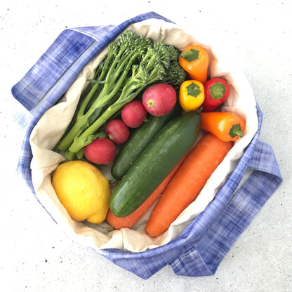 Single Produce Pod reusable veggie storage bag featuring a custom Plum print standing open filled with fresh veg and fruit on a white background, available in Australia.