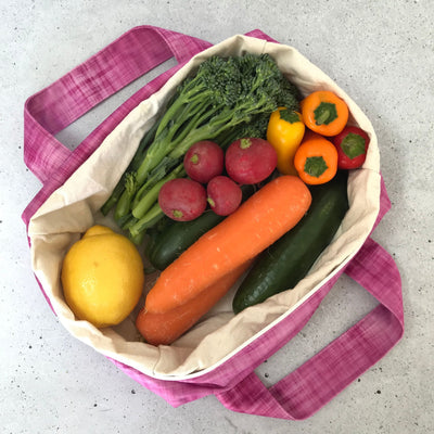 Single Produce Pod reusable veggie storage bag featuring a custom Rhubarb print standing open filled with fresh veg and fruit on a white background, available in Australia.