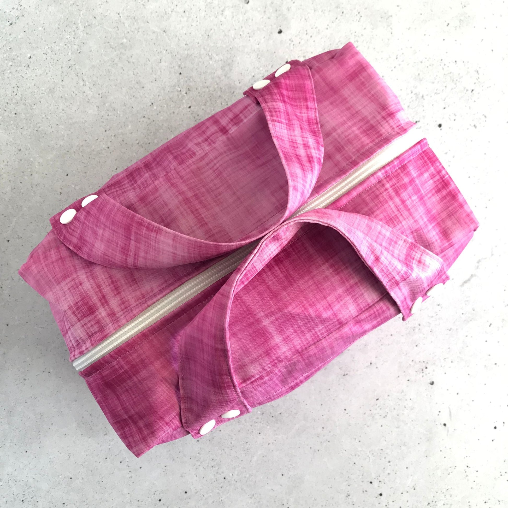 Top down view od a single Produce Pod reusable veggie storage bag featuring a custom Rhubarb print.