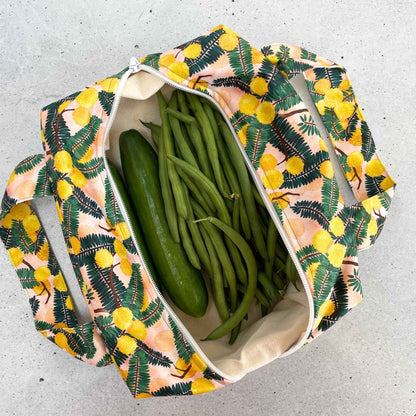 Single Produce Pod reusable veggie storage bag featuring a custom Wattle print standing open filled with fresh veg and fruit on a white background, available in Australia.