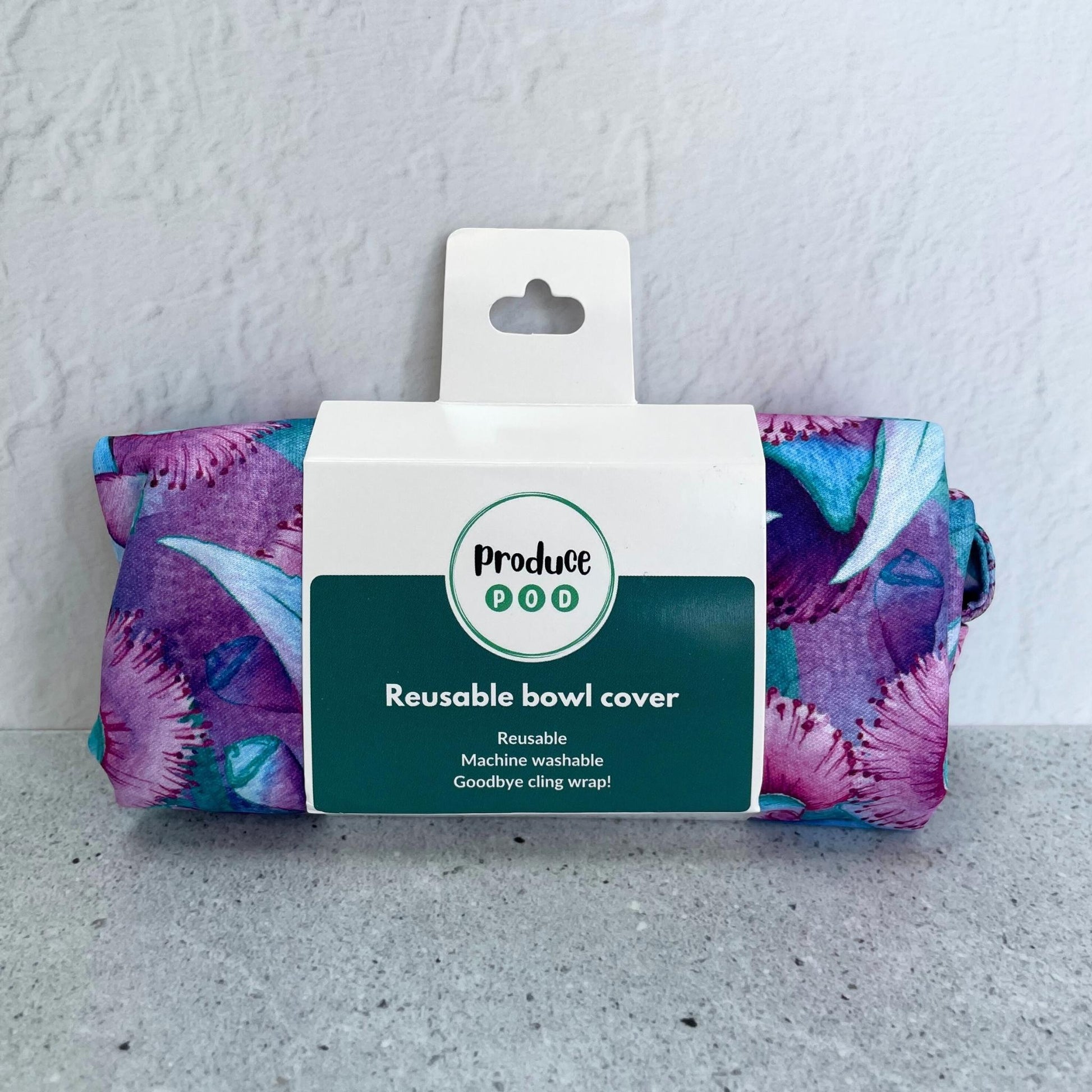 A Produce Pod reusable bowl cover in a Gum blossom print folded in packaging.