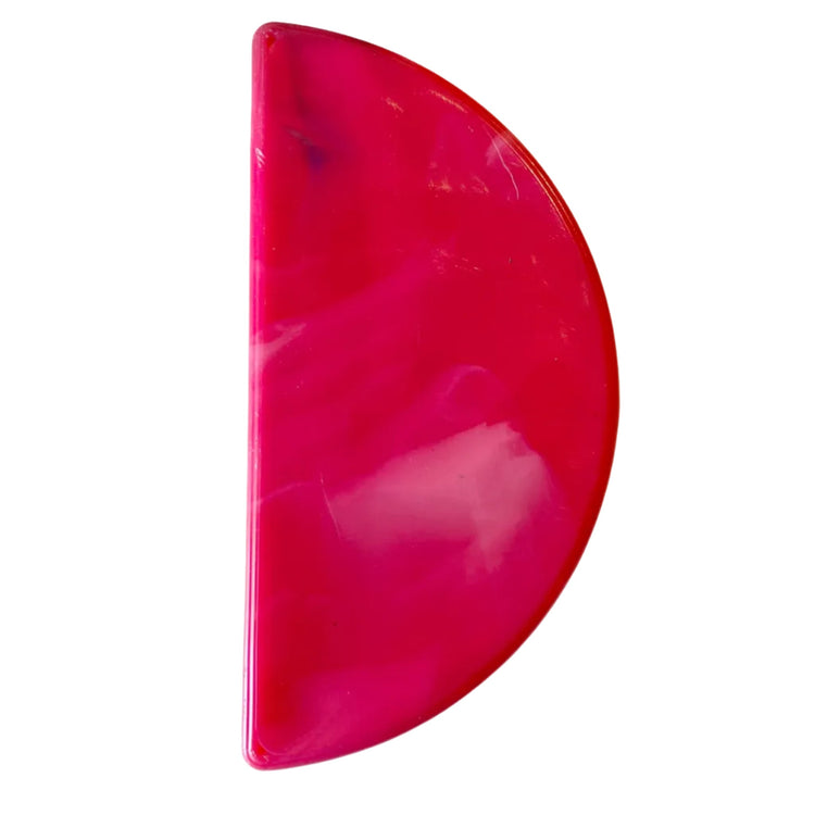 Single 96mm half moon drawer pull handle made from eco friendly marbled recycled plastic in pink.