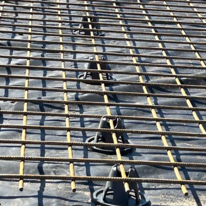 Sustainable concrete rebar chairs made from 100% recycled Dulux powder coating waste, compliant with AS2425 structural reinforcement standards in position ready for concrete.