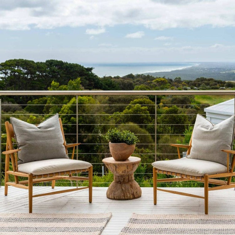 Modern outdoor patio styling featuring the Zebra Home Macintosh durable recycled plastic doormat next to outdoor seating in a Sydney home.