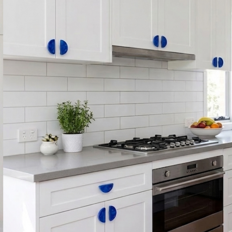 Blue recycled plastic semi circle handles installed in a modern kitchen.