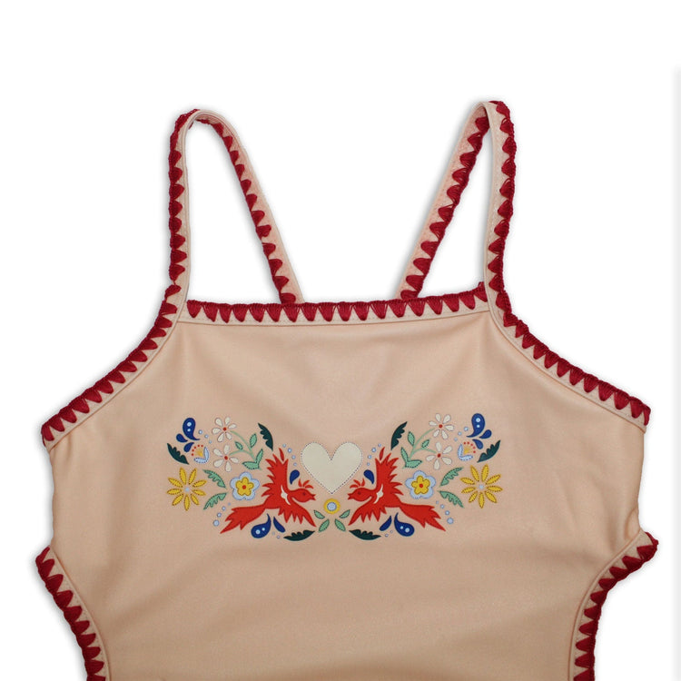 Close-up detail of the premium embroidered fire bird chest print and stitched scallop borders on the kids bather.