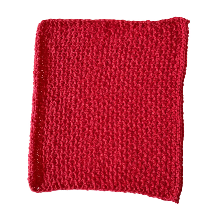 Red handmade knitted dishcloth made from absorbent recycled cotton for kitchen and bathroom use.