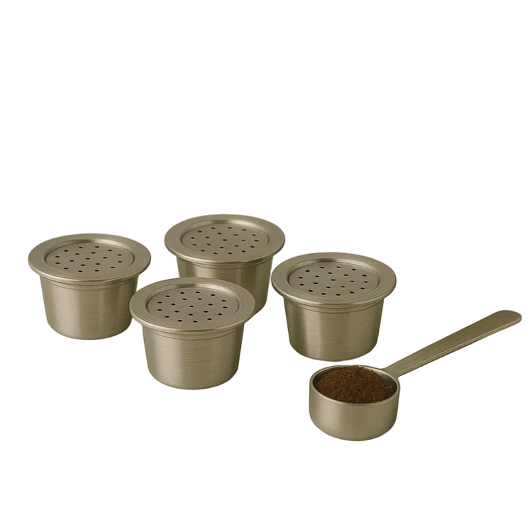 Four eco-friendly reusable stainless steel espresso capsules arranged on a plain white studio background for high-volume coffee drinkers.