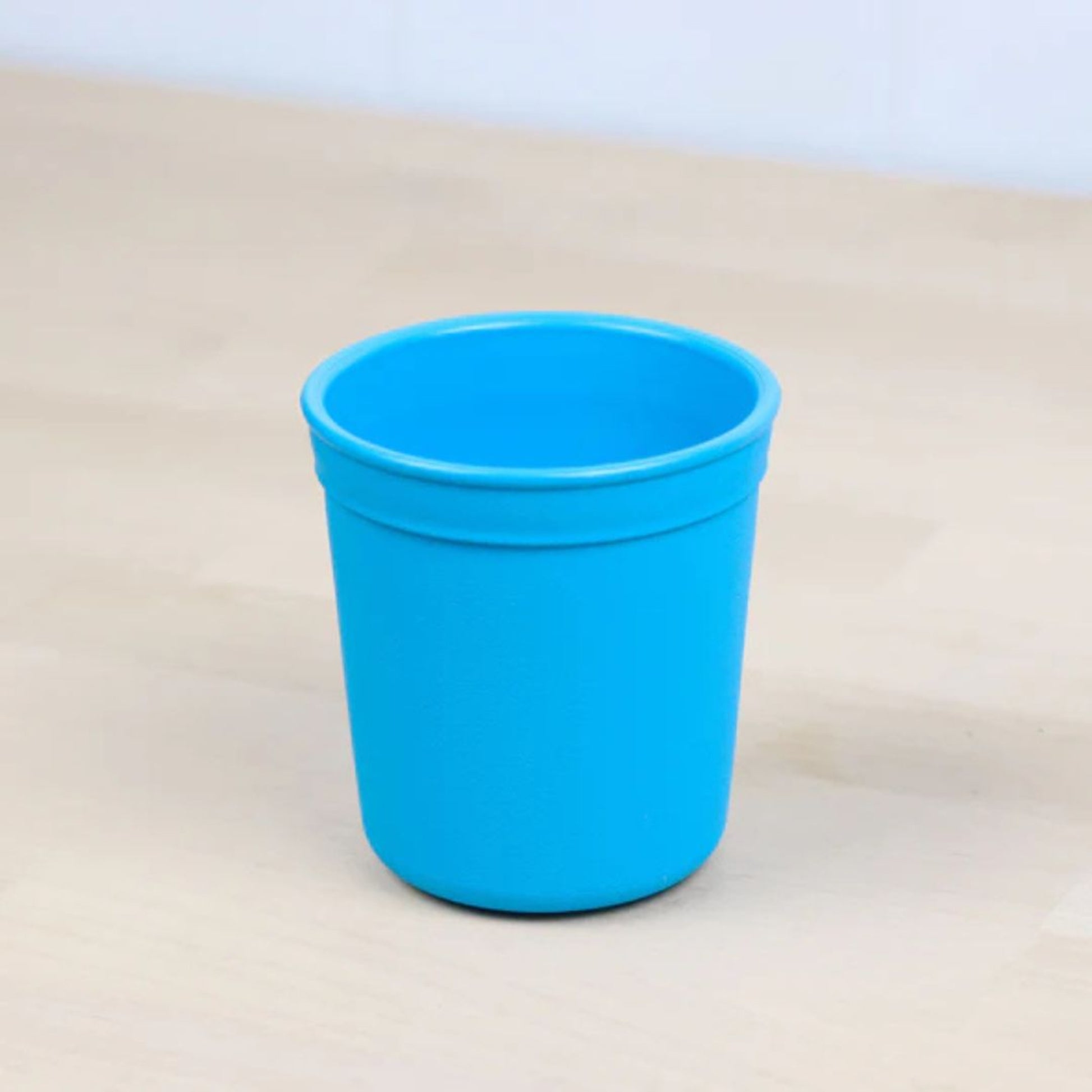 Single Re Play recycled plastic tiny tumbler open cup base with a textured grip surface on a clean white background, available in Australia in sky blue.