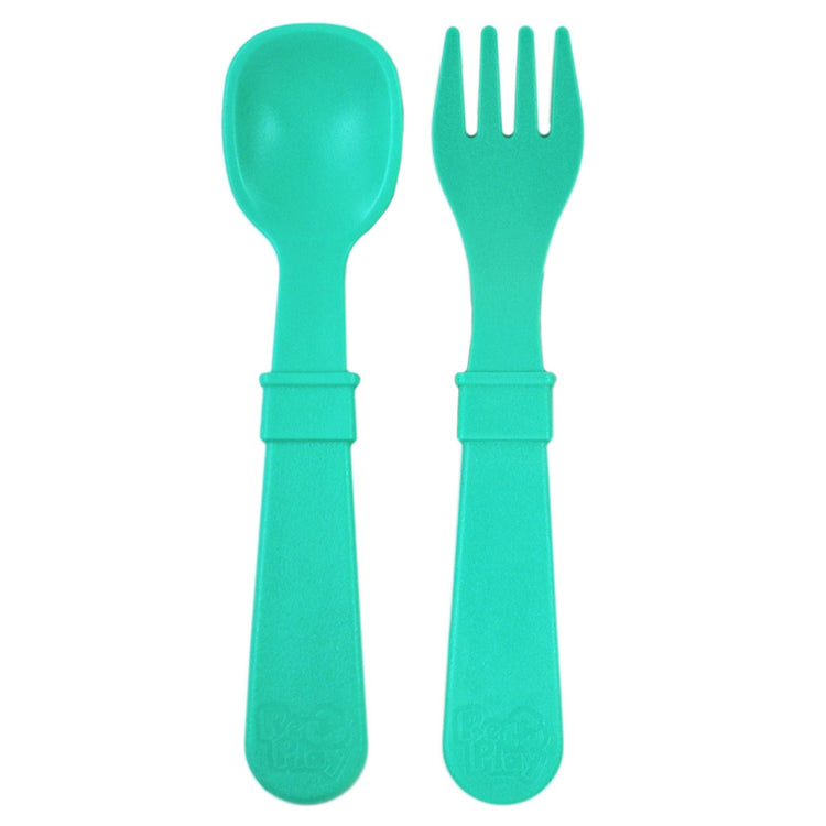 Single matching Re Play recycled plastic toddler fork and spoon cutlery set on a clean white background, available in Australia in Aqua