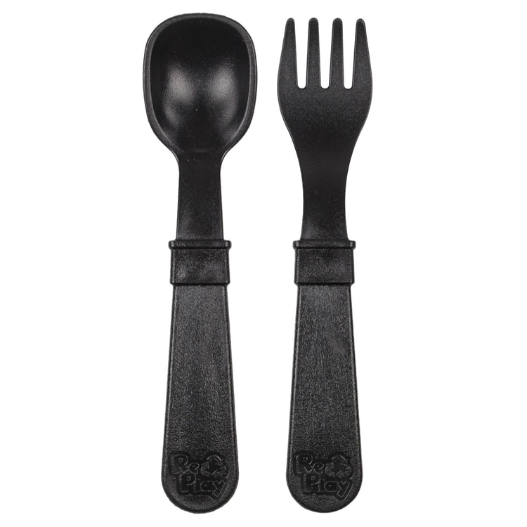 Single matching Re Play recycled plastic toddler fork and spoon cutlery set on a clean white background, available in Australia in Black