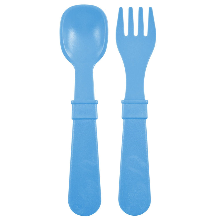Single matching Re Play recycled plastic toddler fork and spoon cutlery set on a clean white background, available in Australia in Denim