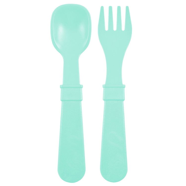 Single matching Re Play recycled plastic toddler fork and spoon cutlery set on a clean white background, available in Australia in Mint