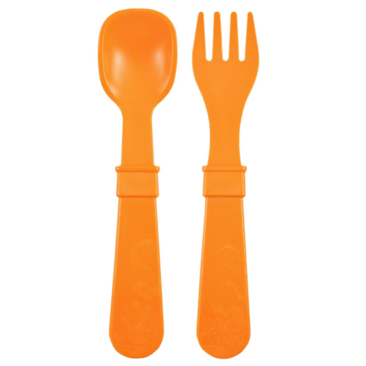 Single matching Re Play recycled plastic toddler fork and spoon cutlery set on a clean white background, available in Australia in orange