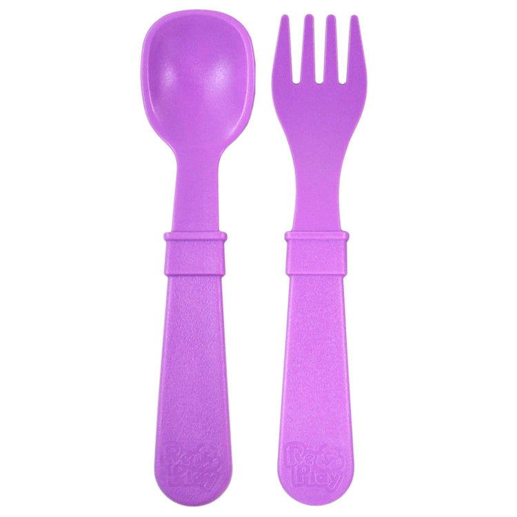 Single matching Re Play recycled plastic toddler fork and spoon cutlery set on a clean white background, available in Australia in Purple