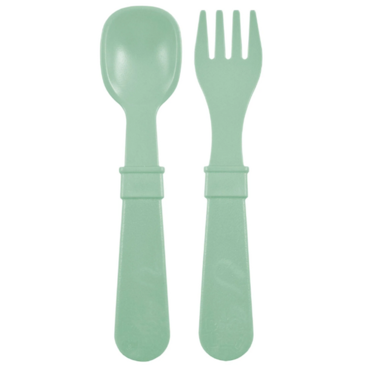 Single matching Re Play recycled plastic toddler fork and spoon cutlery set on a clean white background, available in Australia in sage.