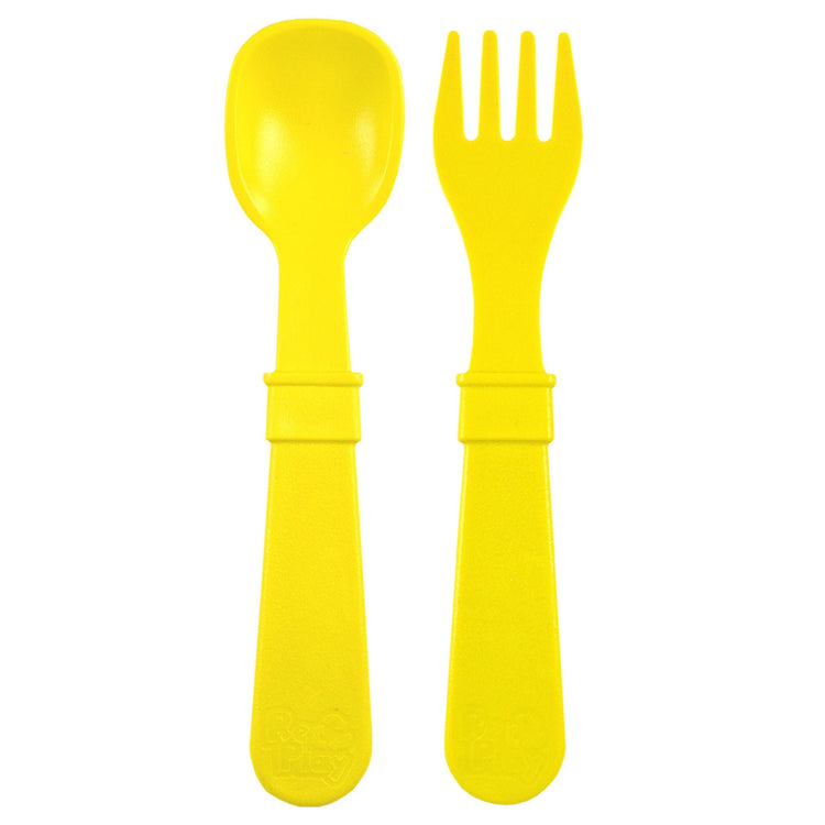Single matching Re Play recycled plastic toddler fork and spoon cutlery set on a clean white background, available in Australia in Yellow