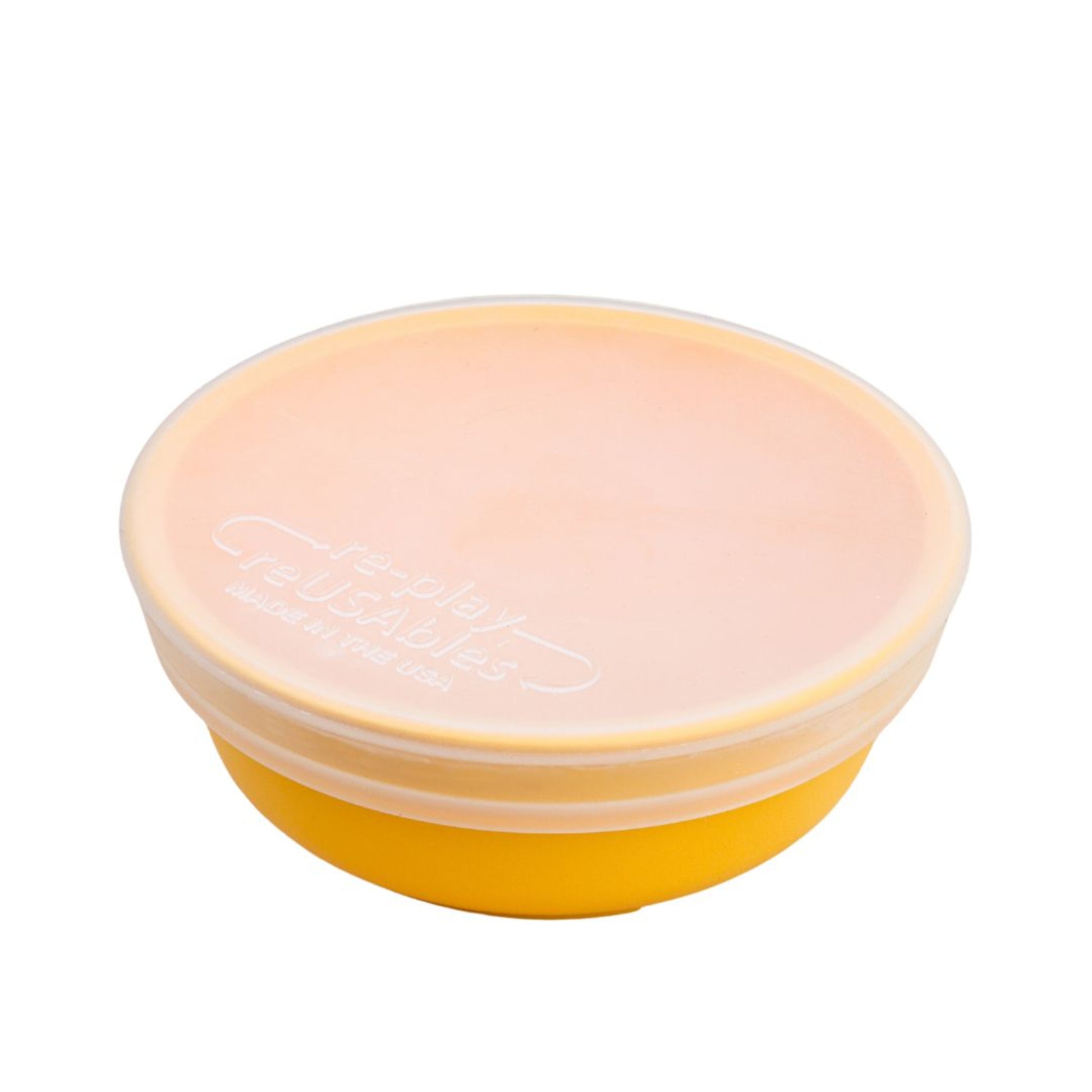 Single Re Play translucent silicone bowl lid fitted securely over a small twelve ounce children's tableware dish on a clean white background, available in Australia.