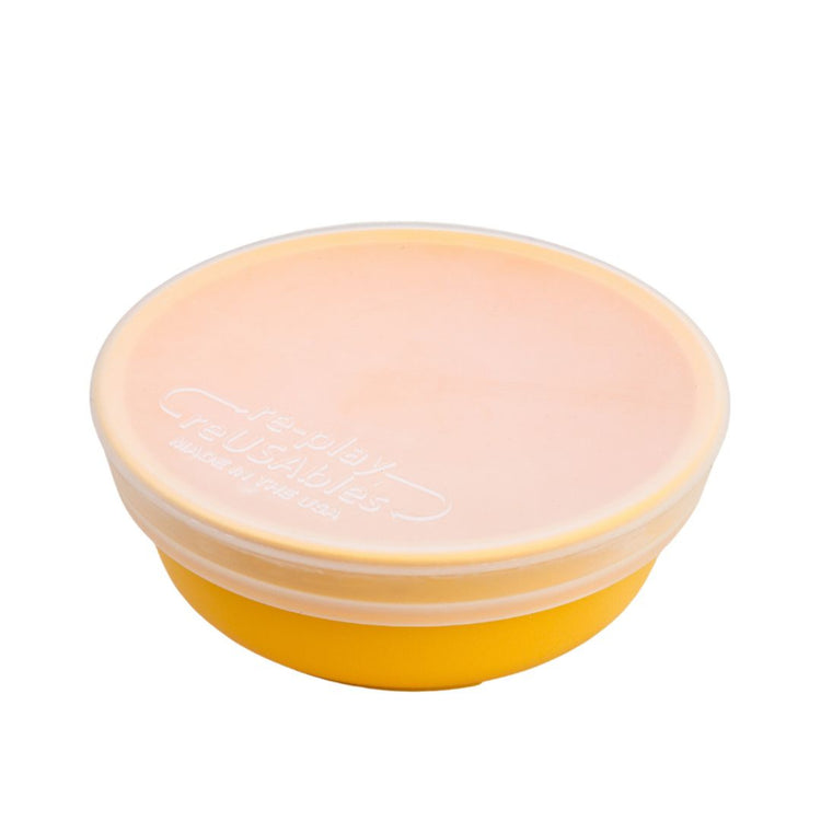Single Re Play translucent silicone bowl lid fitted securely over a small twelve ounce children's tableware dish on a clean white background, available in Australia.