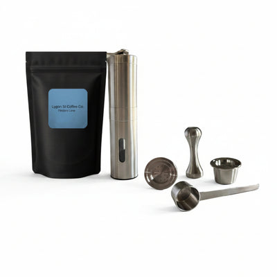 Pod Star barista pack for Espressotoria coffee machines featuring two stainless steel reusable pods, a manual coffee grinder, an espresso tamper, a scoop, and premium coffee beanson a white background.