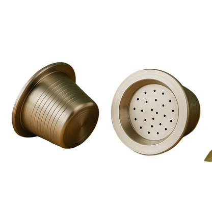 Two refillable stainless steel coffee pods displayed on a white background.