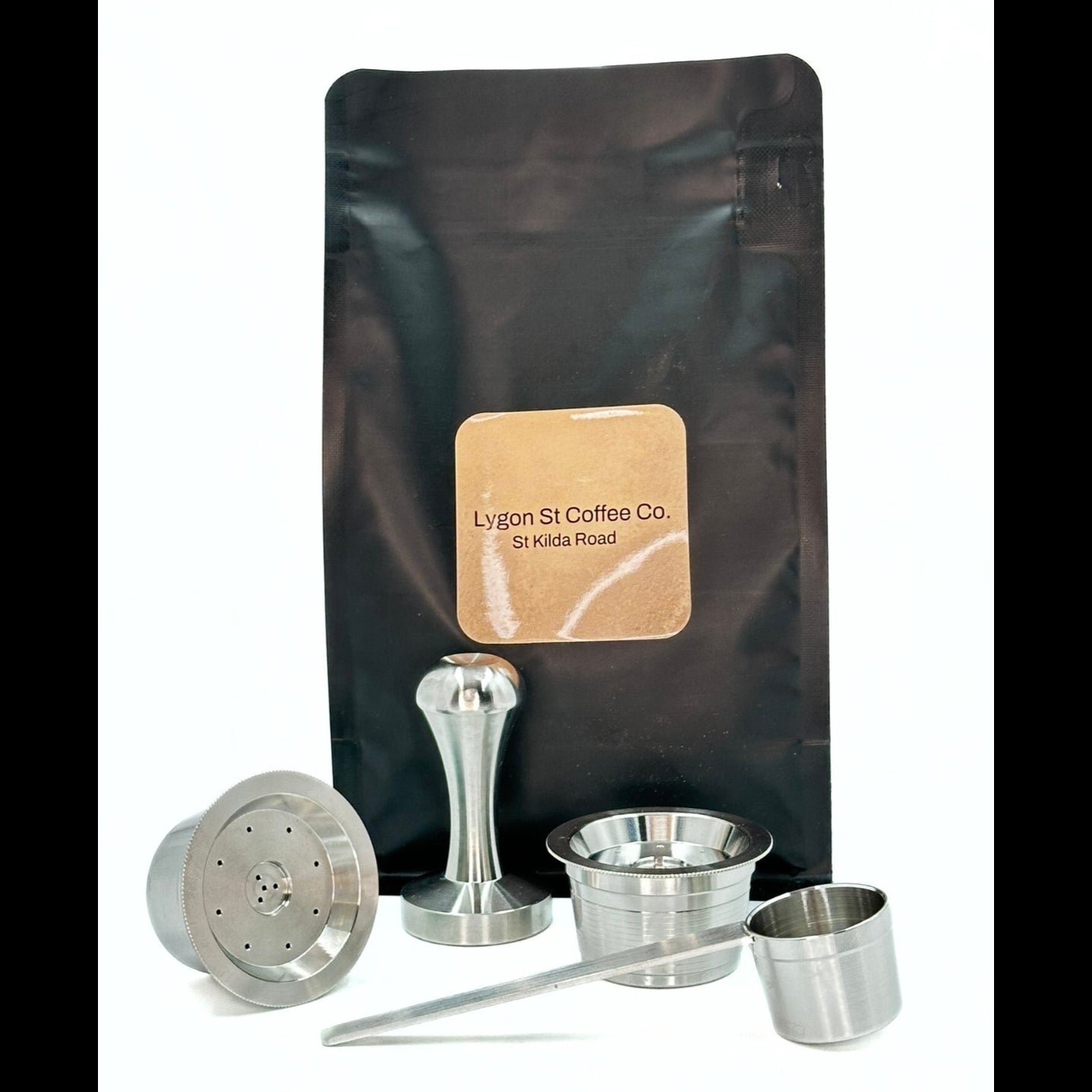 Pod Star starter pack for Aldi K-fee Expressi and Caffitaly  featuring two stainless steel capsules, tamper, scoop, coffee.