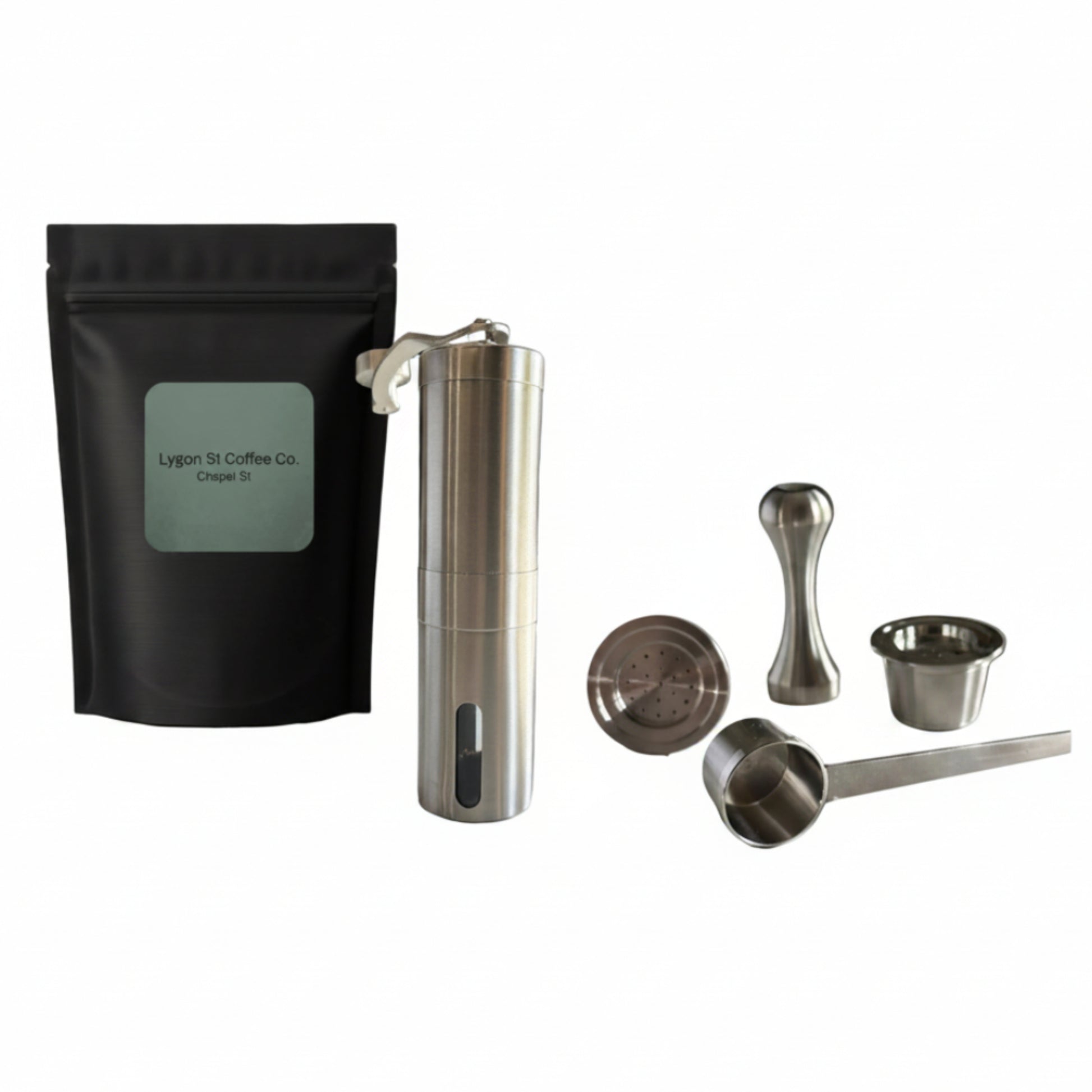 Pod Star ultimate pack for Espressotoria coffee machines featuring four stainless steel reusable capsules, a manual burr grinder, an espresso tamper, a scoop, and coffee beans on a white background.