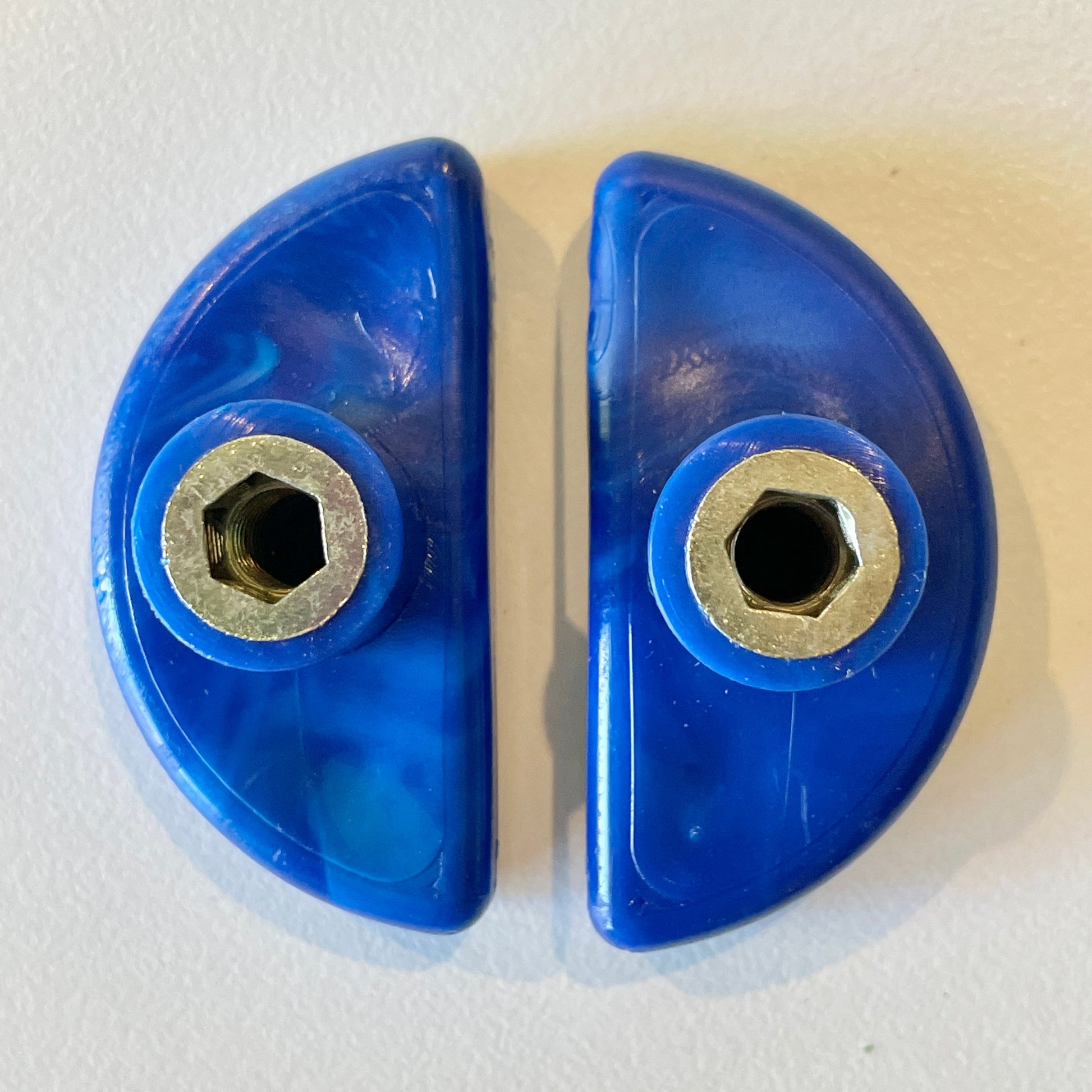 Semi-circle 50mm finger pull cabinet handle in blue finish. Back view showing fittings.