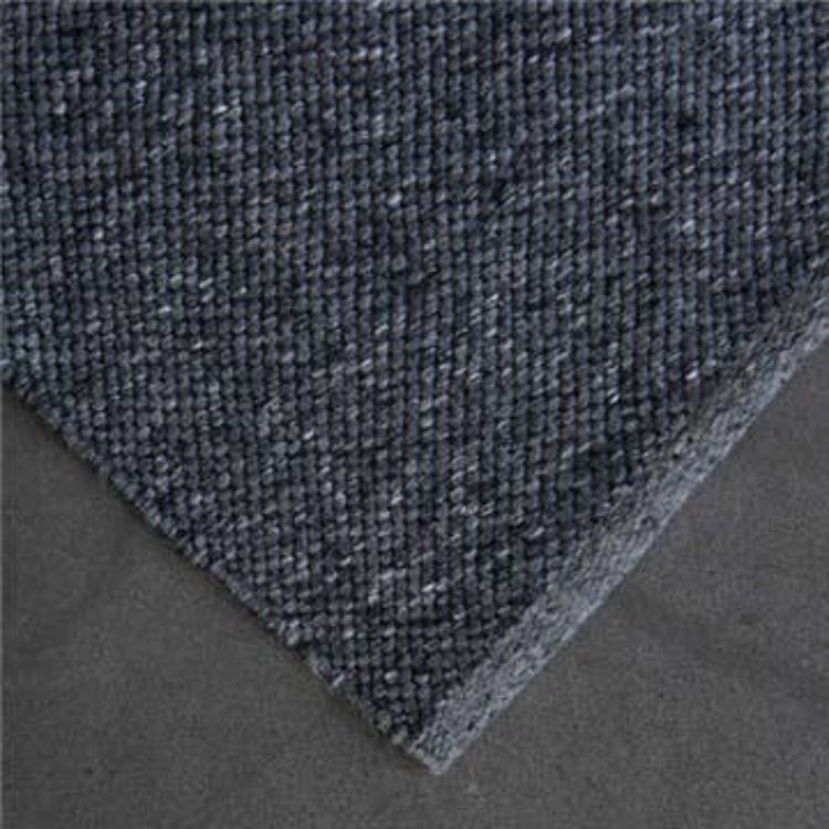High-resolution close-up corner view showing the flatweave texture of the Zebra Home Clements eco-friendly charcoal grey floor rug.