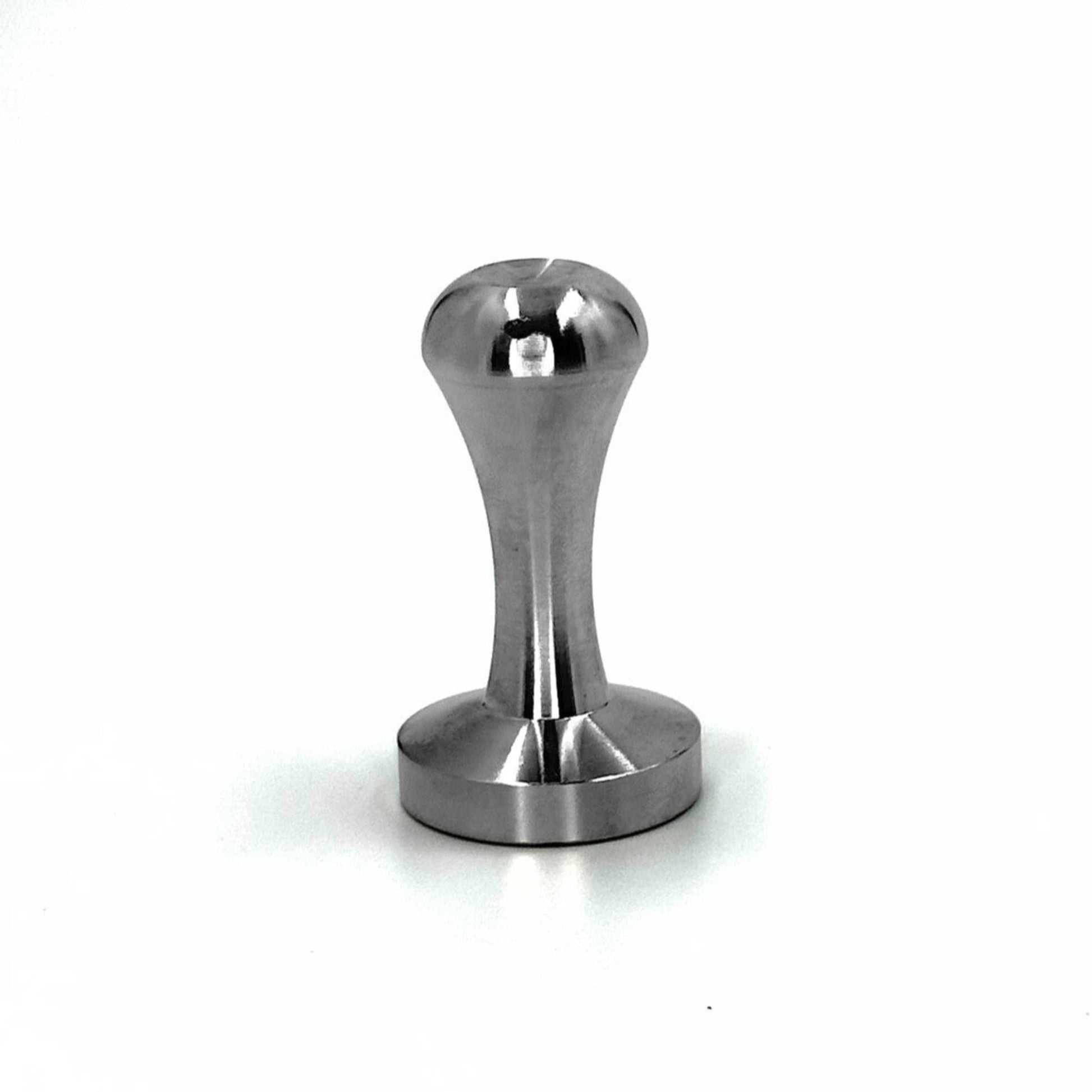 Durable stainless steel coffee packing tamper designed to compress coffee grounds evenly into Pod Star reusable capsules.