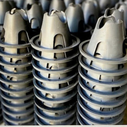 Close-up of the PostPrime polymer crown geometry on eco-friendly rebar spacers manufactured in Robe, South Australia.