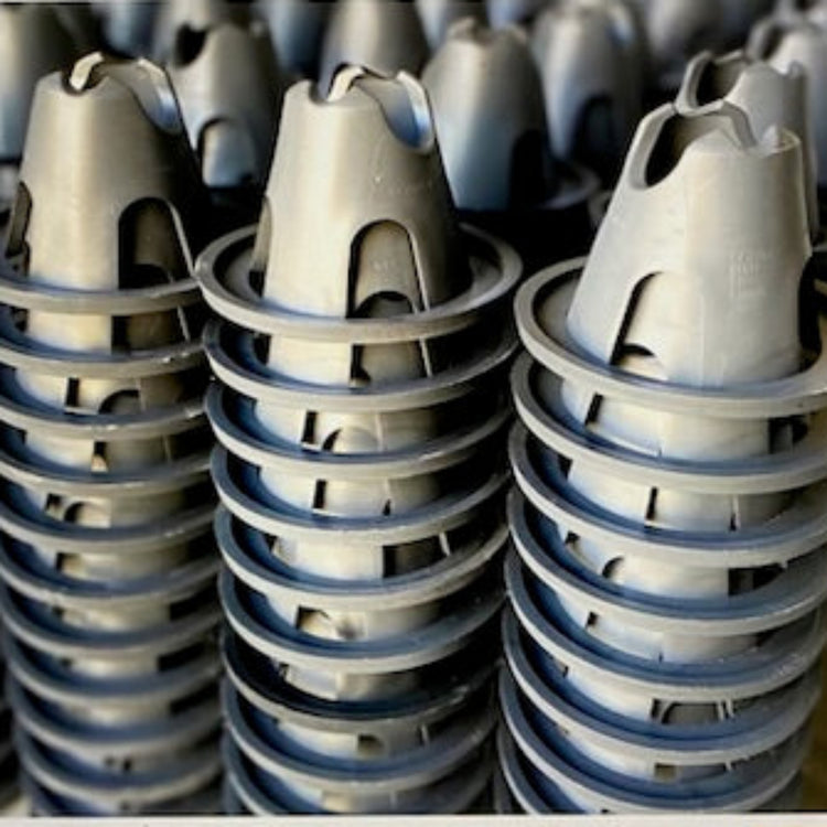 Close-up of the PostPrime polymer crown geometry on eco-friendly rebar spacers manufactured in Robe, South Australia.
