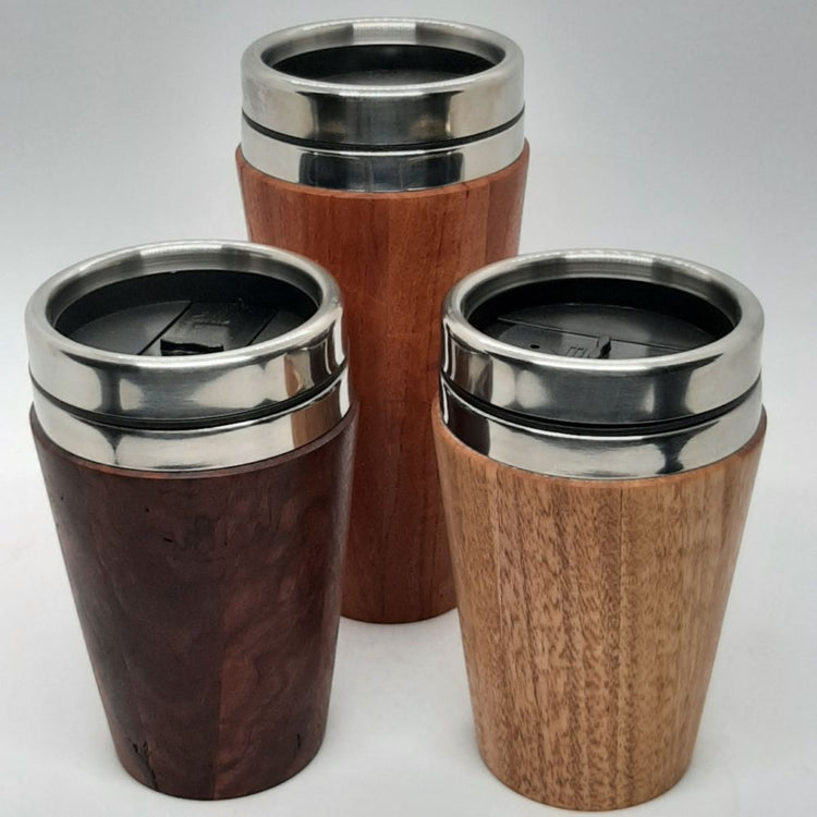 Three insulated hand-turned recycled timber coffee travel mug with a stainless steel interior lining, handcrafted in Australia by Lyons Woodturning showing colour variation.