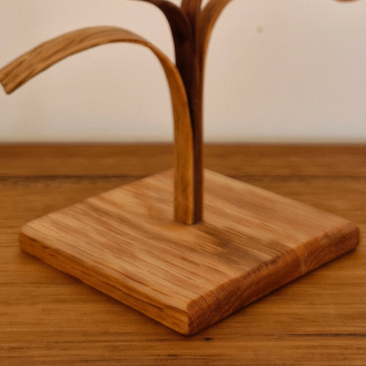 Close-up detail of upcycled American Oak and Blackwood sculpture, showcasing artisan craftsmanship.