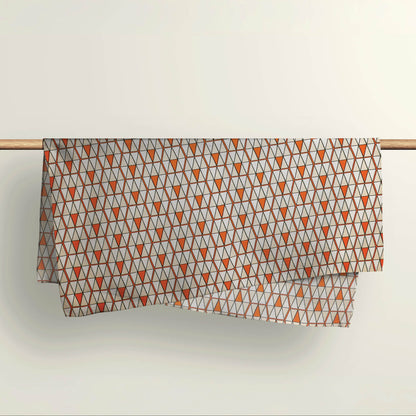 The Triangulation geometric fabric wrap draped over a wooden rod to show the premium deadstock material texture.