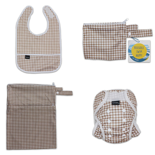 Three-piece baby swim gift set featuring an adjustable nappy, wet bag, and waterproof bib in fawn check.