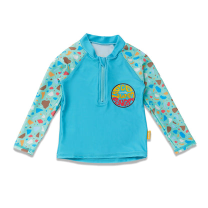 Kids long sleeve rash guard in turquoise blue Ocean Glass print with terrazzo raglan sleeves and front chest zip.