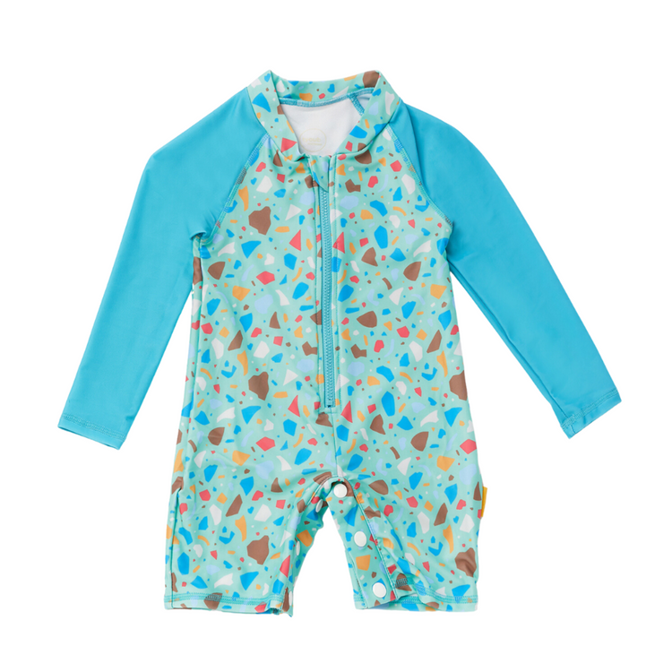 Kids long sleeve one piece sunsuit in turquoise blue Ocean Glass print with terrazzo sleeves and long front zip.