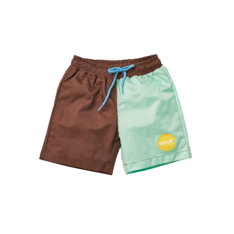 Kids quick dry board shorts in Mint Slice brown and pastel green color block with an adjustable waist drawstring.