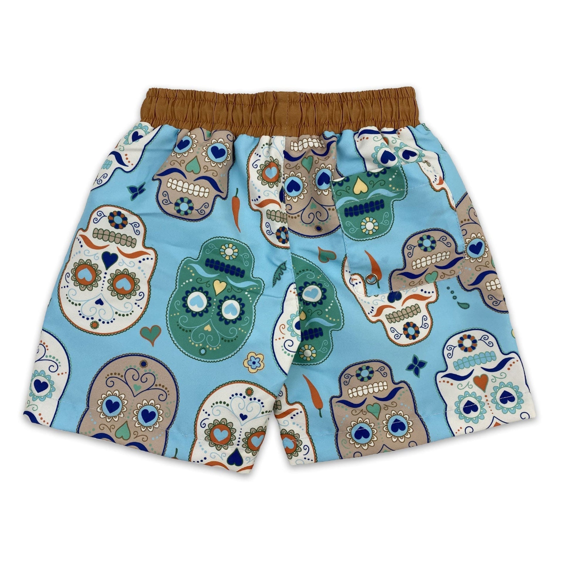 Kids quick dry boardshorts in aqua blue Skulls Amigo day of the dead sugar skull print back view.