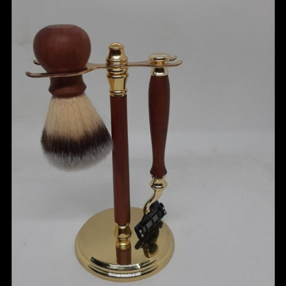 The ultimate 6-piece men's grooming kit showing the recycled timber Gillette Mach III razor, shave brush and display stand in gold.