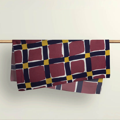 The Unchained pattern fabric wrap draped over a wooden rod to show the premium deadstock material texture.
