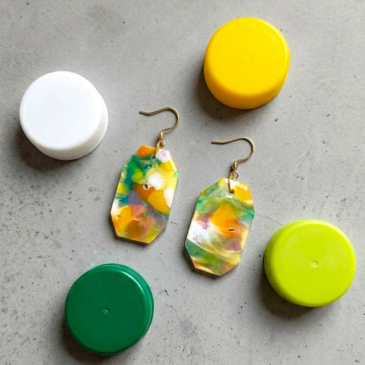 Detailed close-up highlighting the artisan marbled texture, smooth finish, and distinctive yellow and green color swirls on these eco-friendly octagon earrings.