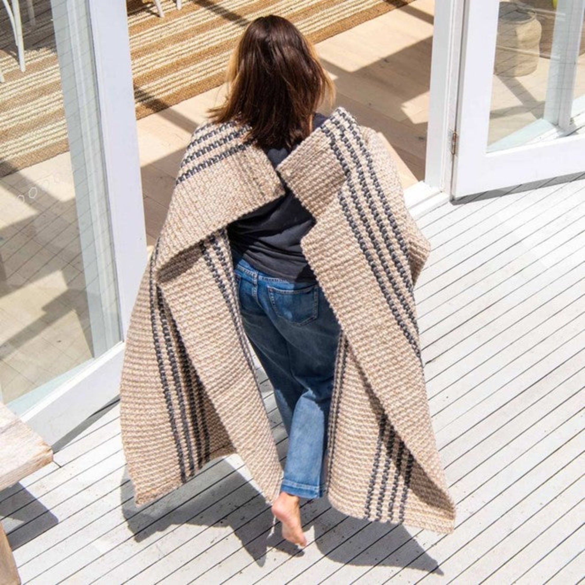 High-traffic entryway styled with a Zebra Home Macintosh washable runner rug on an outdoor timber deck.