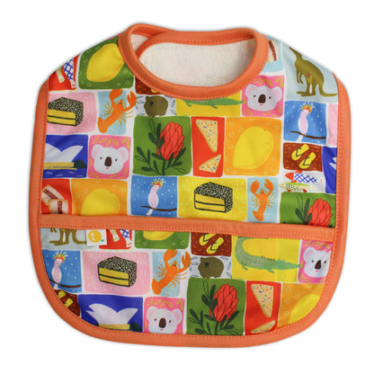 Lightweight waterproof baby bib in Aussie icons with an integrated crumb catch-all front pocket closed.