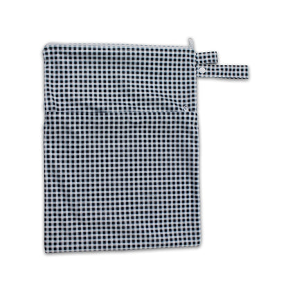 Waterproof baby travel wet bag in black check print, featuring a secure zipper and snap pram loop.